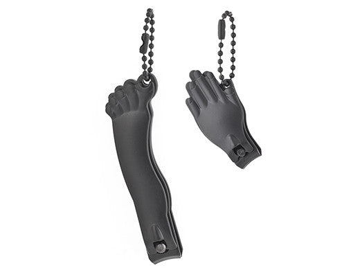 Two black nail clippers, one in the shape of a foot and the other in the shape of a hand.
