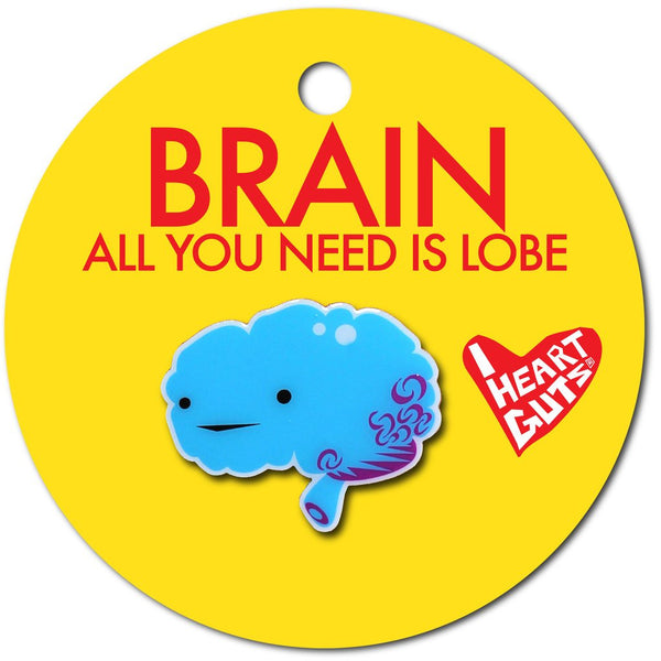 A yellow background with a blue enamel pin in the shape of a brain with two eyes and a smile.