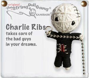 A keychain made of white string depicting a little man with two black eyes and his ribs exposed, holding a chain.