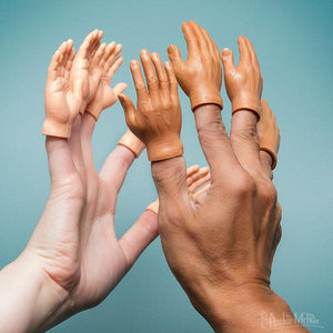 One light skinned hand and one dark skinned hand in a high-five pose. Each finger has a small hand puppet on it with the corresponding skin tone.