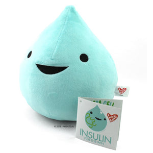 A mint green plush in the shape of a drop of insulin with two eyes and a smile.