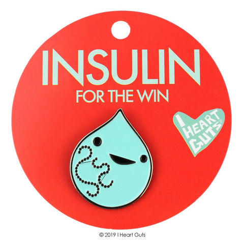 A red card with "Insulin For the Win" in mint green. There is an enamel pin in mint green depicting a drop of insulin.